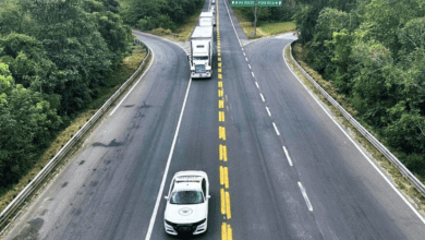 a white car and semi truck on a road GUARDIA NACIONAL